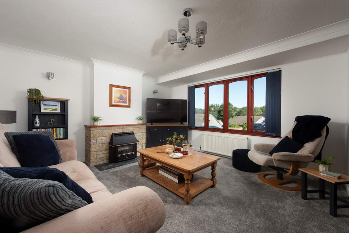 Cosy up in the sitting-room by the ornamental fire or unwind with your favourite shows on the Smart TV.