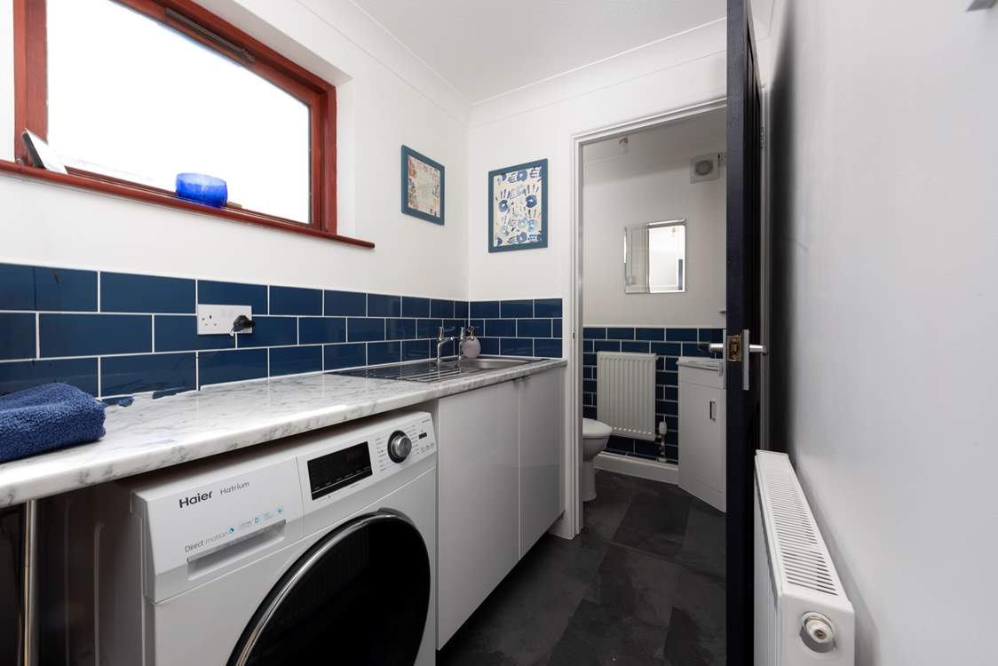A utility-room with washing machine and dryer as well as a handy cloakroom downstairs for your convenience.