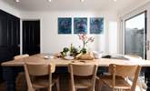 Gather round and plan your day's adventures in the spacious dining-area. - Thumbnail Image