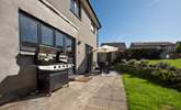 Fire up the barbecue and enjoy al fresco dining in this charming garden. - Thumbnail Image