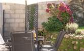 Comfy outdoor seating invites you to unwind and enjoy the fresh air. - Thumbnail Image