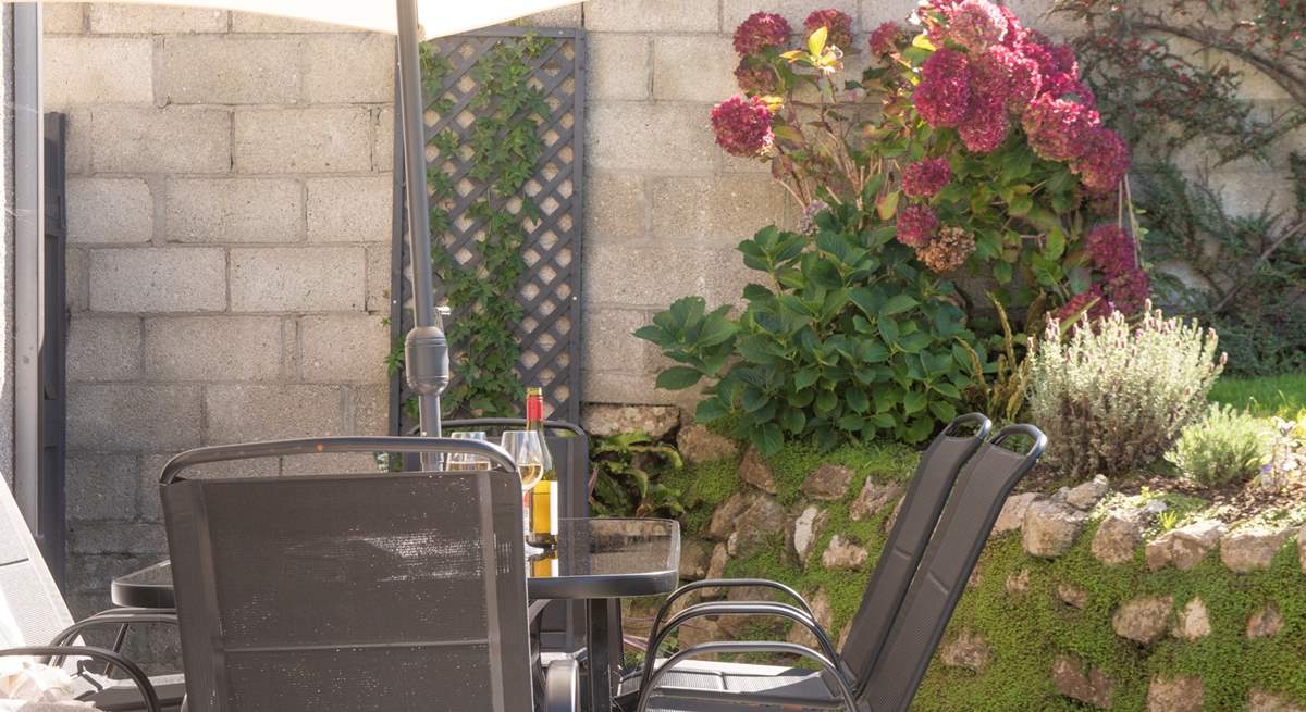 Comfy outdoor seating invites you to unwind and enjoy the fresh air.