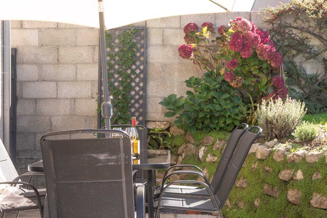Comfy outdoor seating invites you to unwind and enjoy the fresh air.