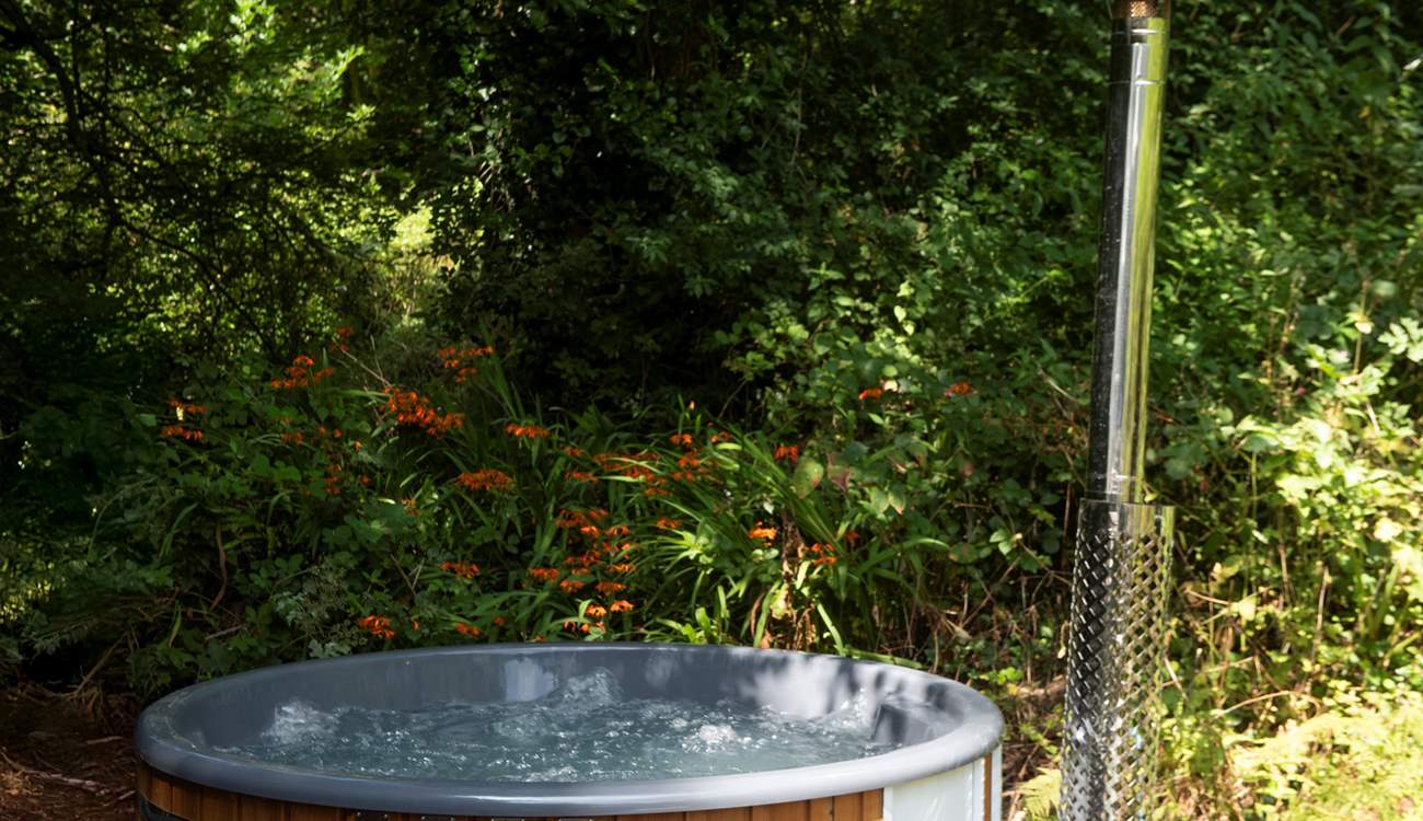 Relax under the canopy of the trees. The bubbling wood-fired hot tub is a real treat! Please note, guests are required to fill the hot tub if they wish to use it during their stay.