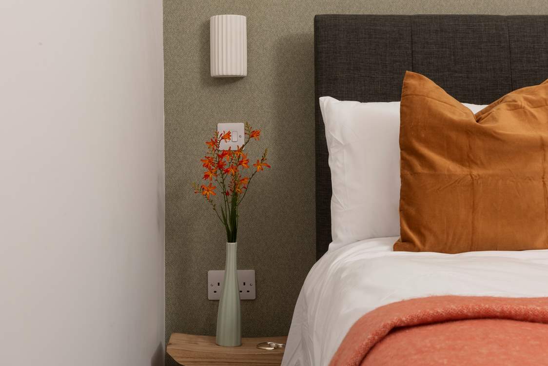 The tones perfectly complement the woodland setting.