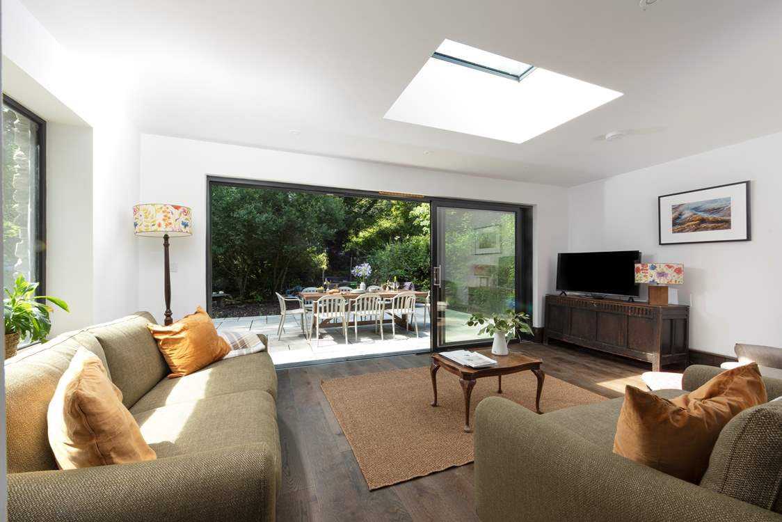Huge sliding doors lead from the lounge out to the terrace.