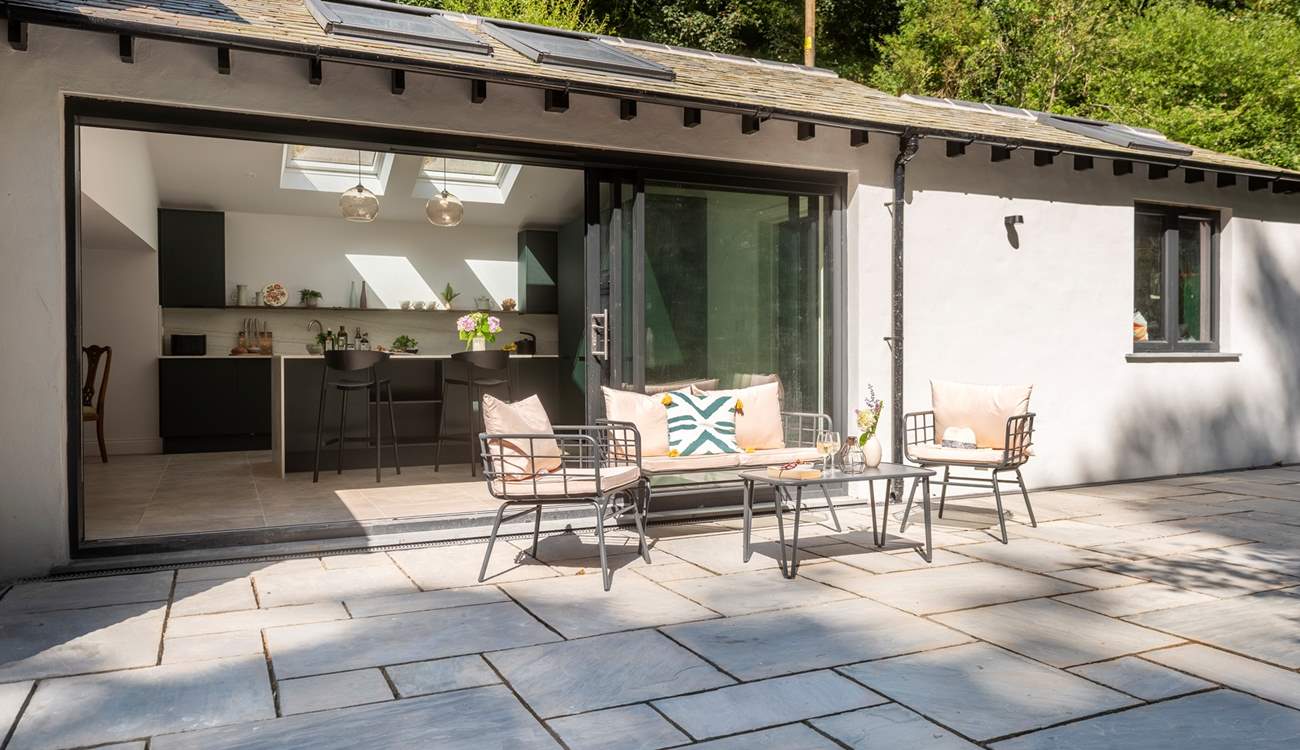 Step out from the kitchen to enjoy morning coffee on the terrace.