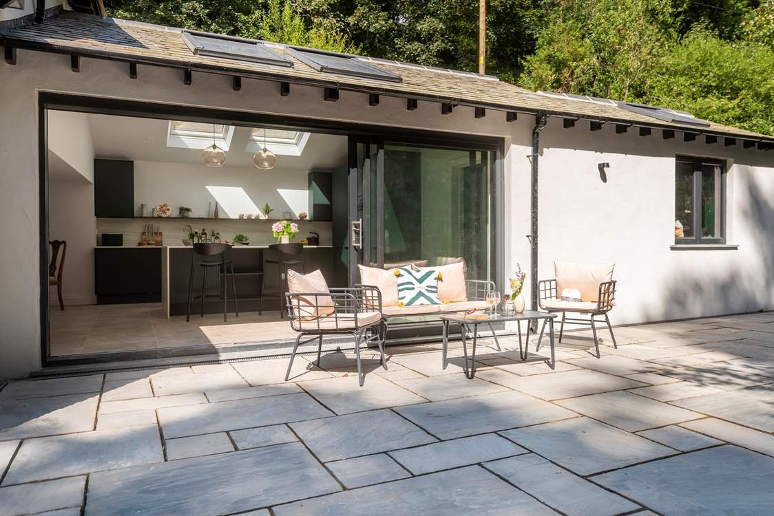 Step out from the kitchen to enjoy morning coffee on the terrace.