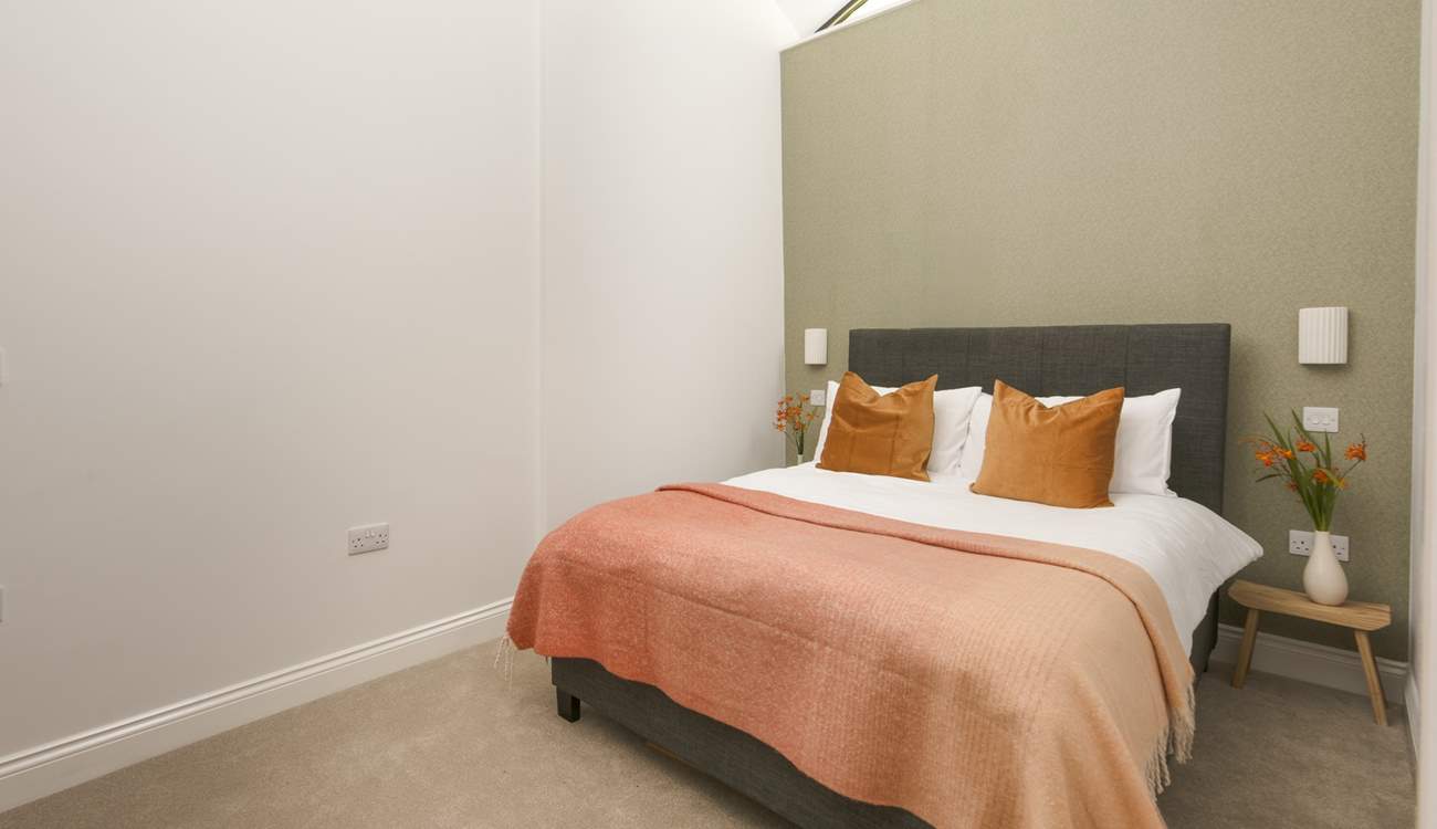 Snuggle under the covers of the double bed in the second bedroom.