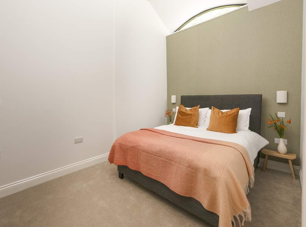 Snuggle under the covers of the double bed in the second bedroom.
