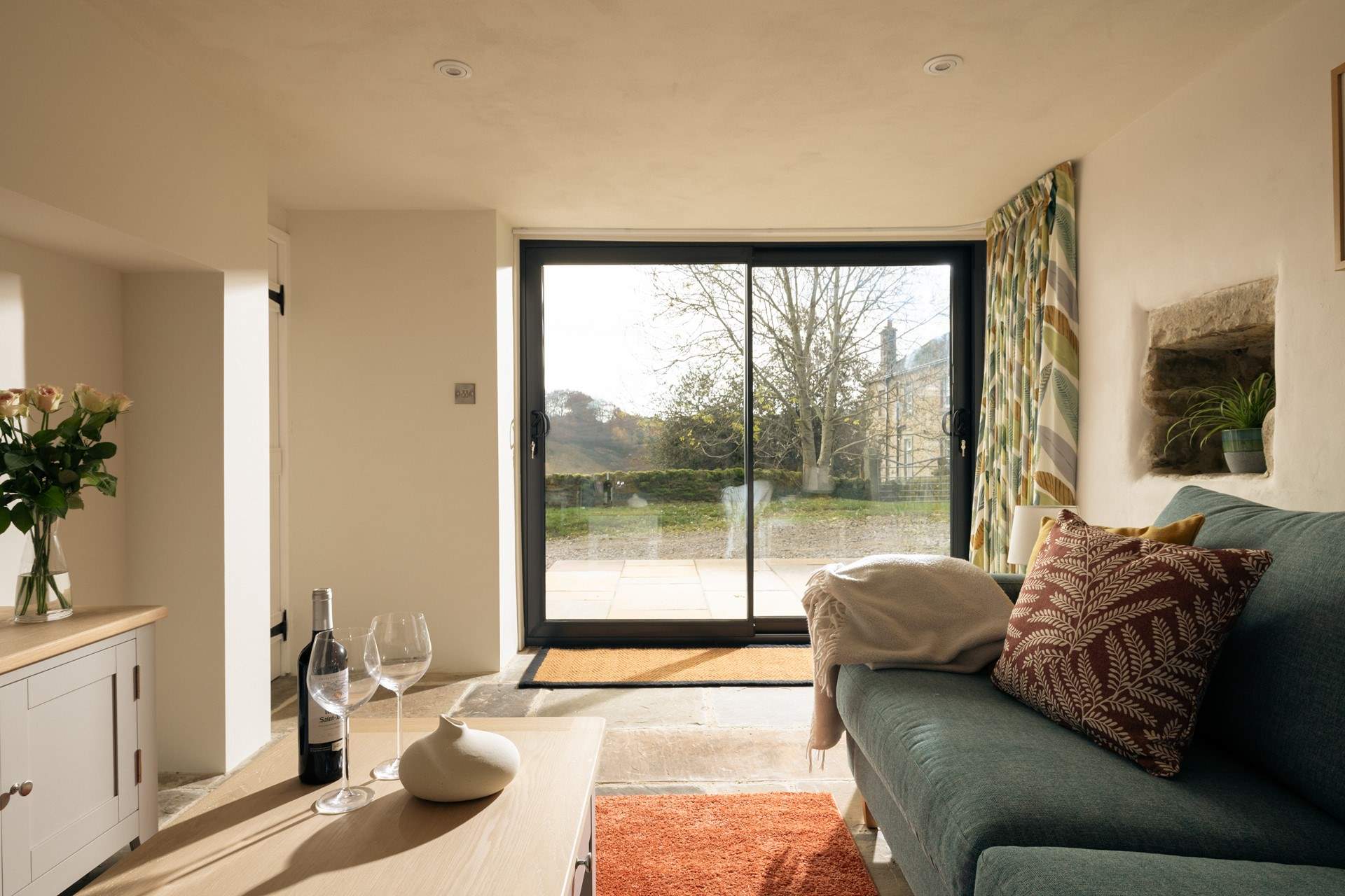 The sitting-room leads out onto the patio.