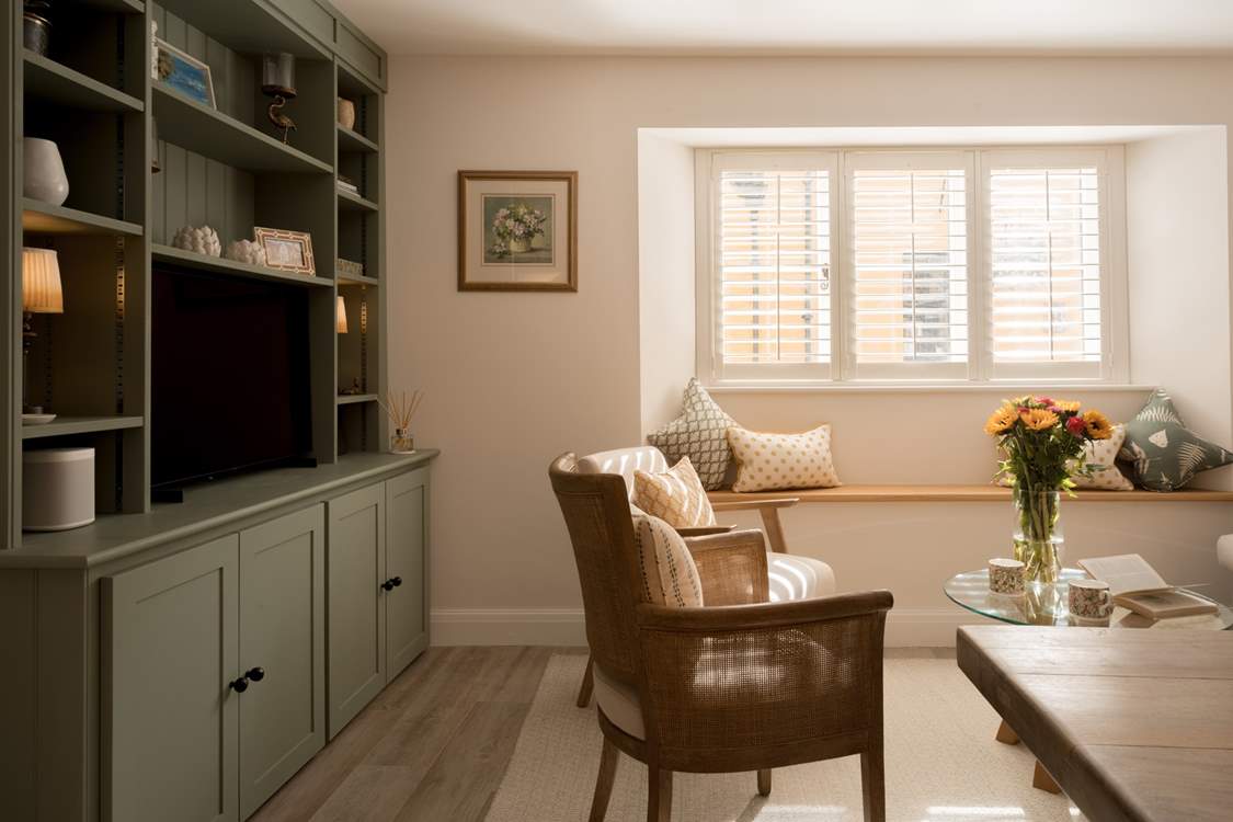 The large window allows the light to set a multitude of moods throughout the day. Perfect for a cosy day in.