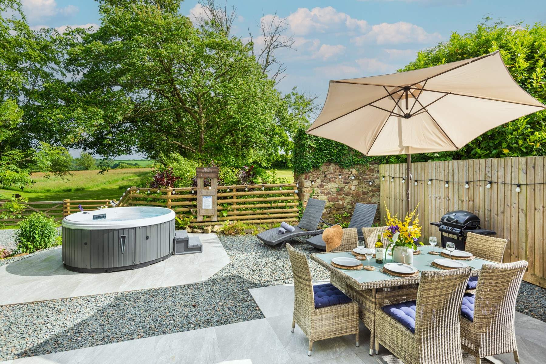 The beautiful al fresco patio area with that all important hot tub!