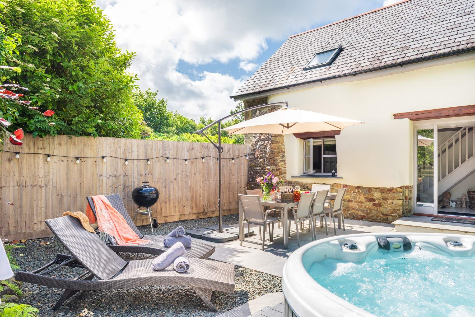 The beautiful al fresco patio area with that all important hot tub!
