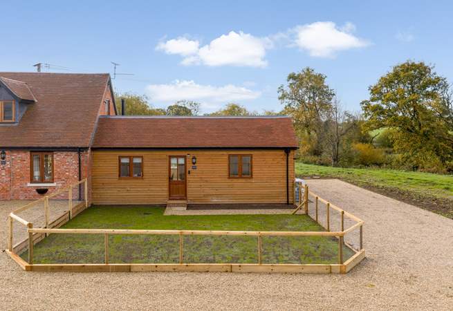 There is plenty of private parking for two cars to the right of the property. Note that there is one small step up into the front door.