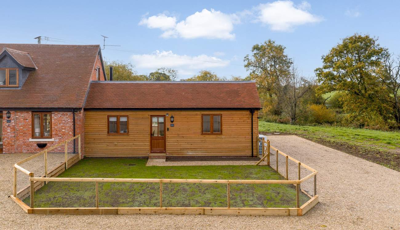 There is plenty of private parking for two cars to the right of the property. Note that there is one small step up into the front door.