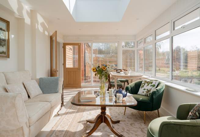 This stunning conservatory is the perfect place to drink in the rural landscape beyond. Lots of comfy seating, a dining space and even a bed for your four-legged friend.