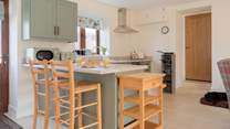 This lovely kitchen is perfectly set up for a lazy start at the breakfast-bar or whipping up a feast for lunch or dinner. 
