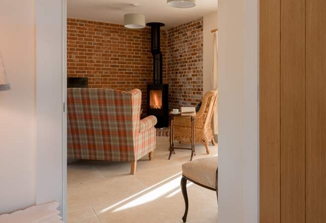 The wood-burner and exposed brickwork make for a really rustic and cosy experience.
