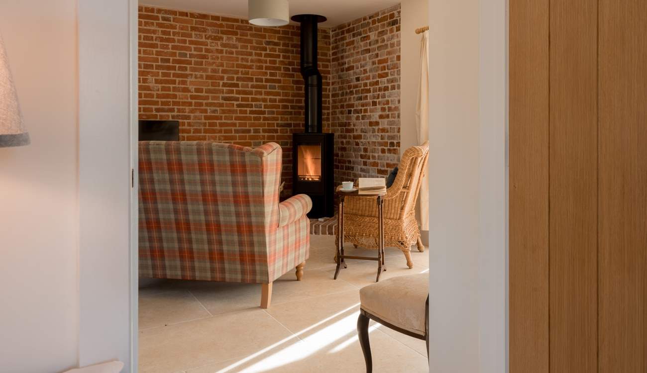 The wood-burner and exposed brickwork make for a really rustic and cosy experience.