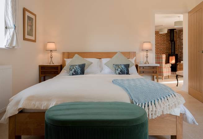 The luxurious bedroom has a sumptuous king-size bed and luxury linens to help you drift off into blissful slumber...
