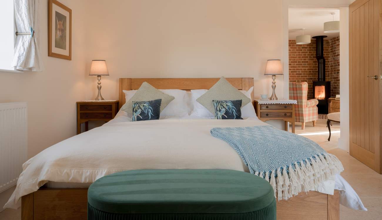 The luxurious bedroom has a sumptuous king-size bed and luxury linens to help you drift off into blissful slumber...