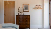 The hand picked vintage furniture is perfectly juxtaposed within the modern clean space.