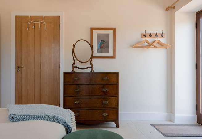 The hand picked vintage furniture is perfectly juxtaposed within the modern clean space.