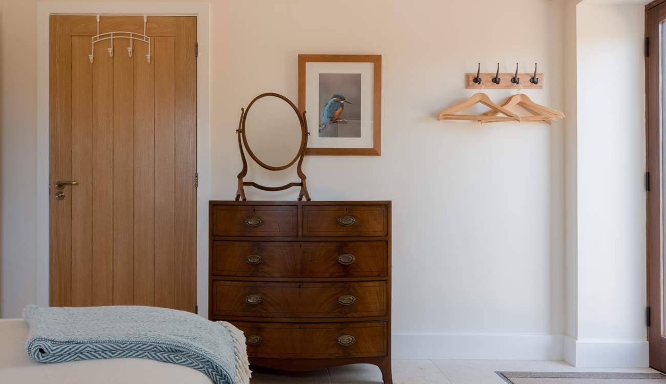 The hand picked vintage furniture is perfectly juxtaposed within the modern clean space.