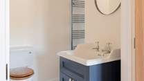 The en suite fixtures have been tastefully selected in striking kingfisher blue.
