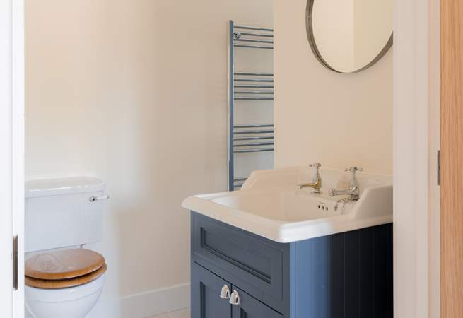 The en suite fixtures have been tastefully selected in striking kingfisher blue.