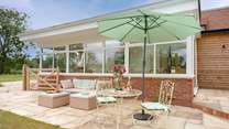 Off the conservatory you will find the lovely, private and enclosed rear garden which looks over fields and provides a wonderful spot to while away the hours...