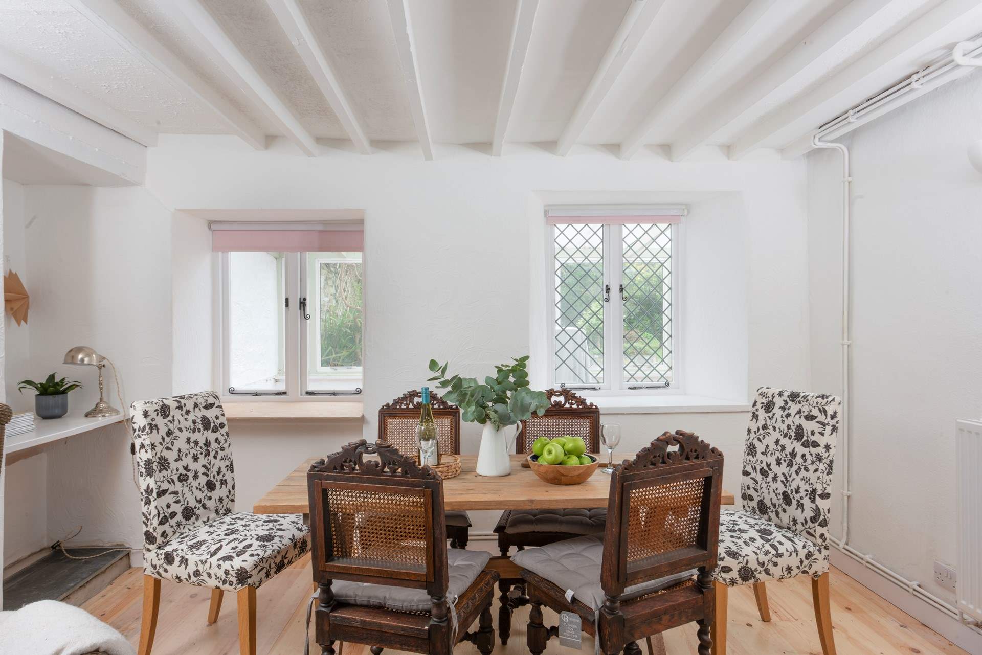 This listed cottage features beautiful beams and antique furniture.