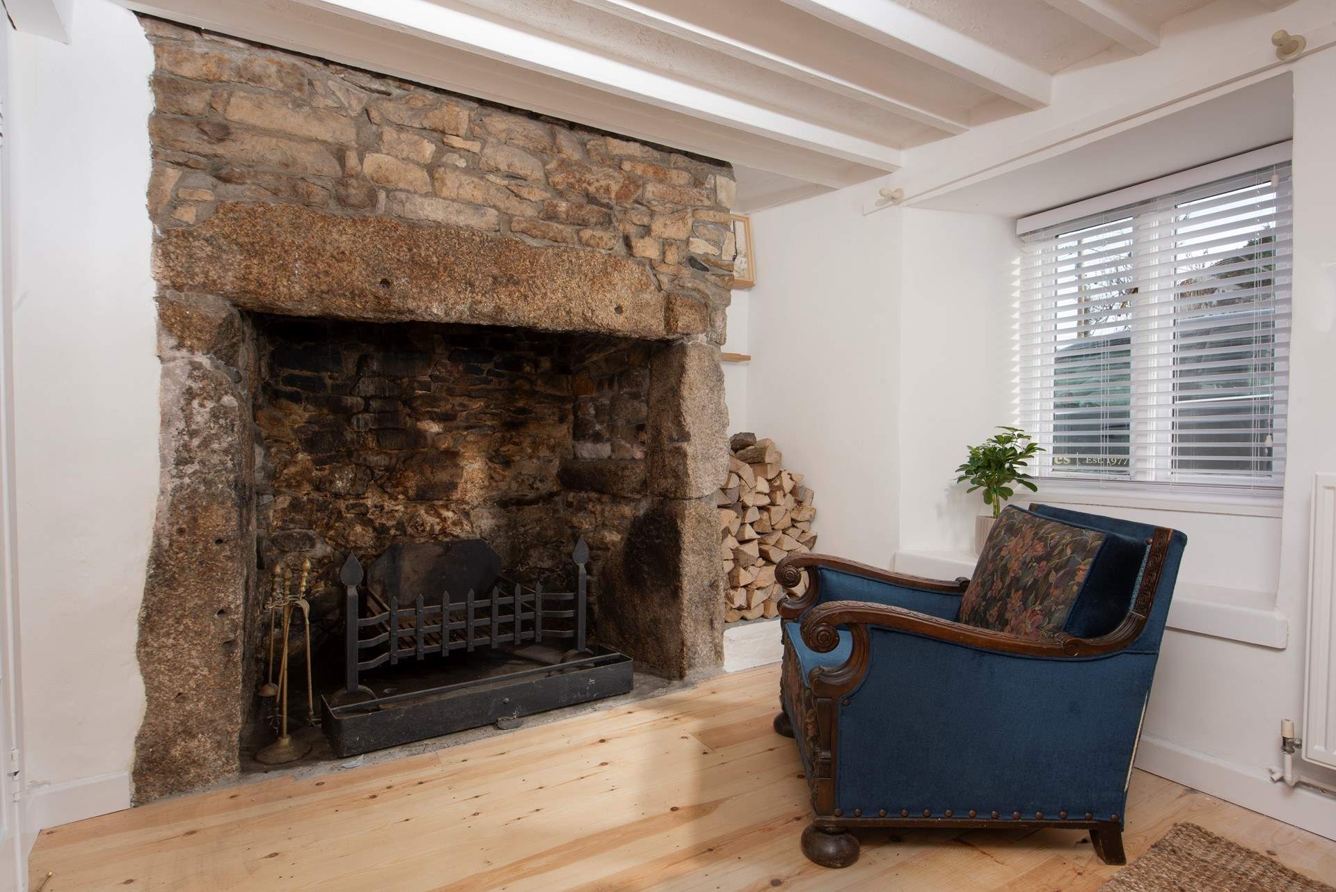 The historic inglenook fireplace is ornamental.