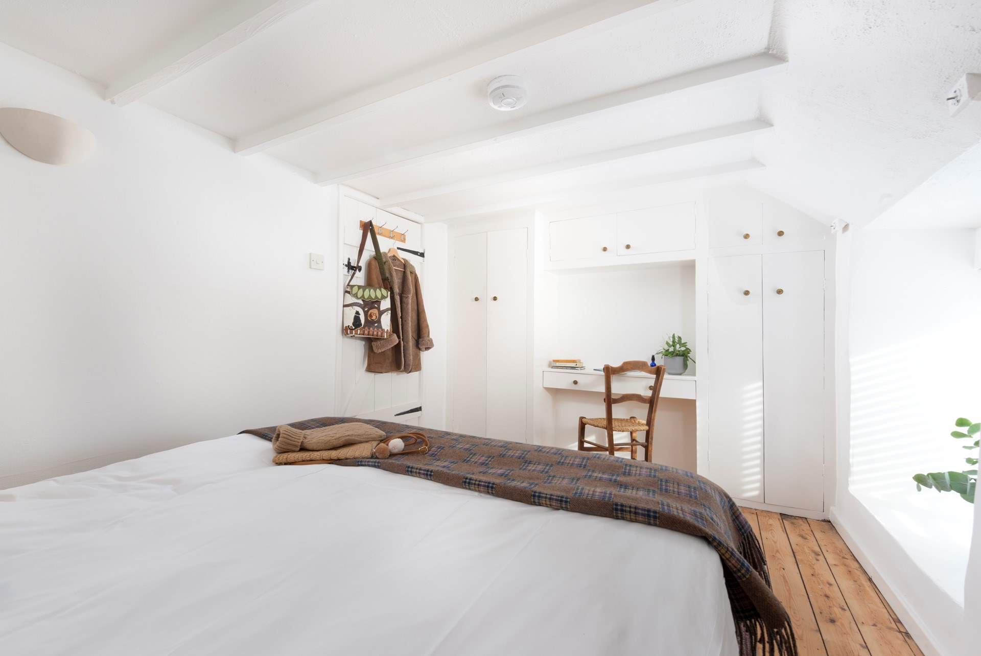 There is a handy dressing-table or writing bureau.