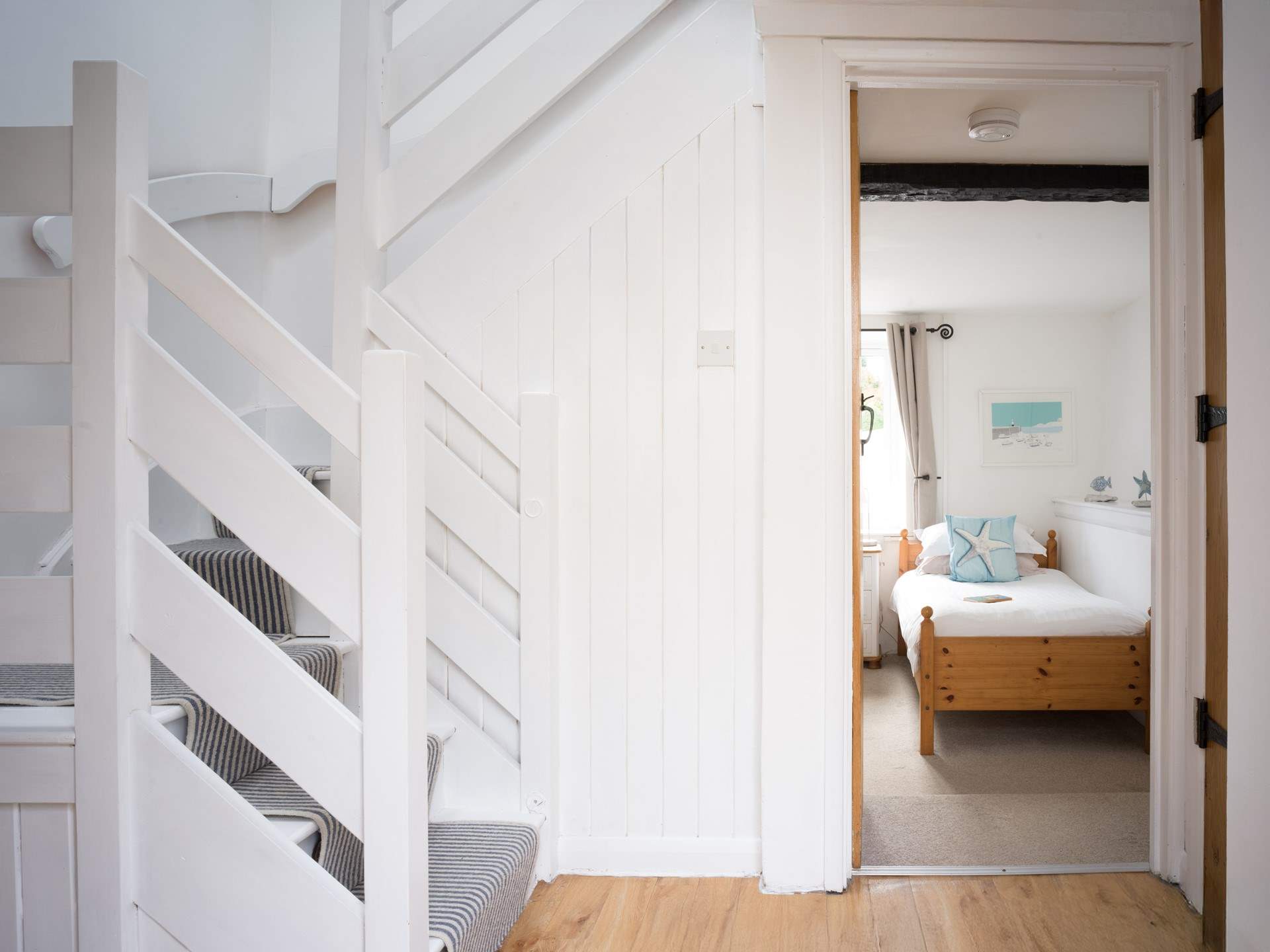 Head upstairs to bedroom 2 and the family bathroom.