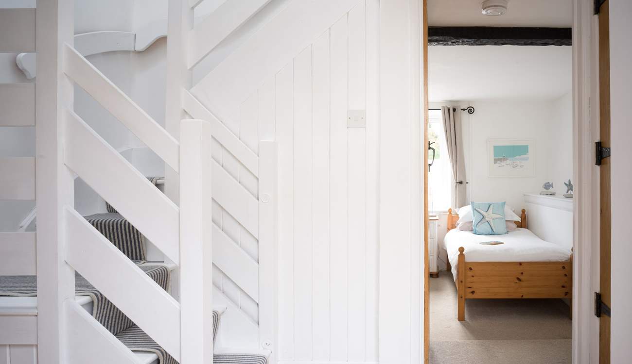 Head upstairs to bedroom 2 and the family bathroom.