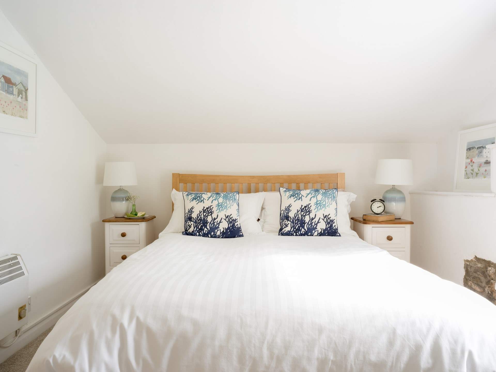Bedroom 2 on the first floor is light and airy.