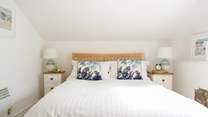 Bedroom 2 on the first floor is light and airy.