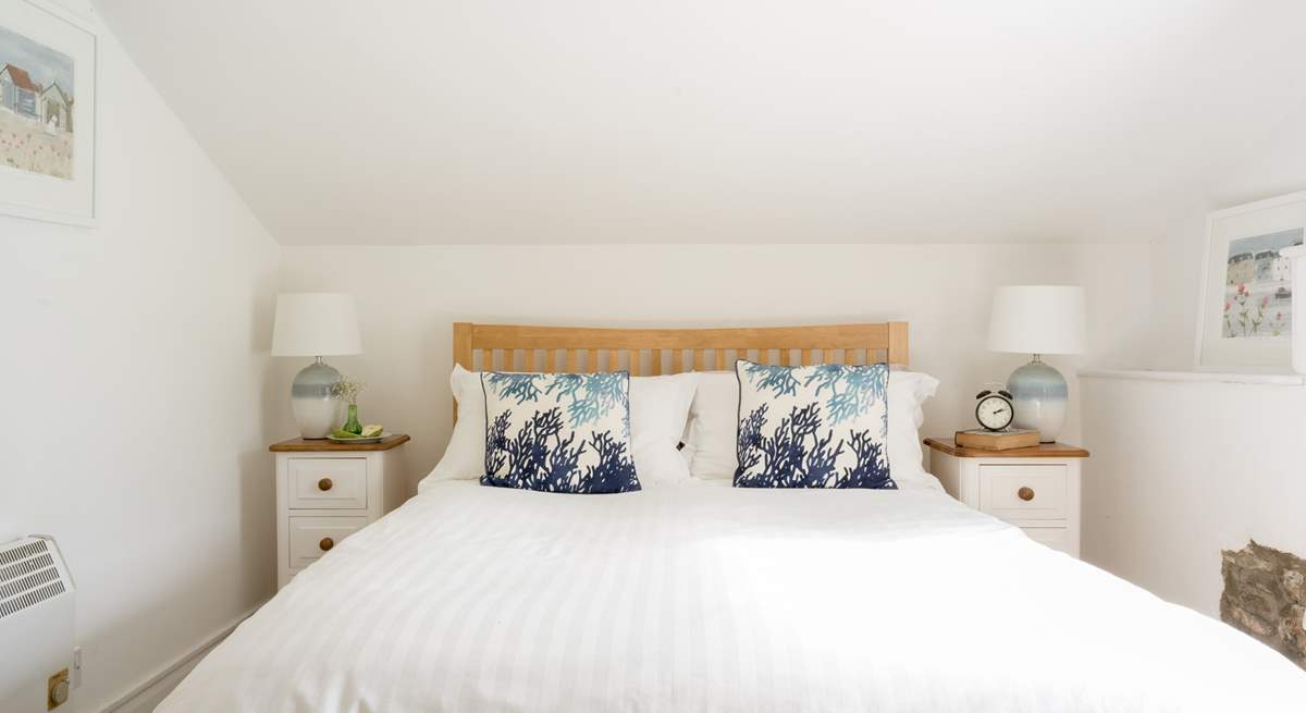 Bedroom 2 on the first floor is light and airy.