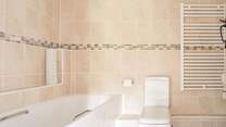 Start the day with a refreshing shower in the family bathroom.