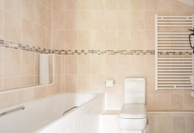 Start the day with a refreshing shower in the family bathroom.