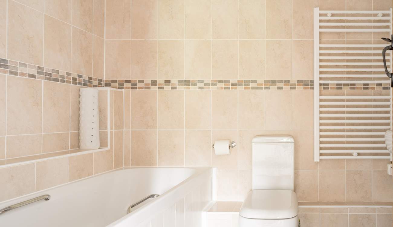 Start the day with a refreshing shower in the family bathroom.