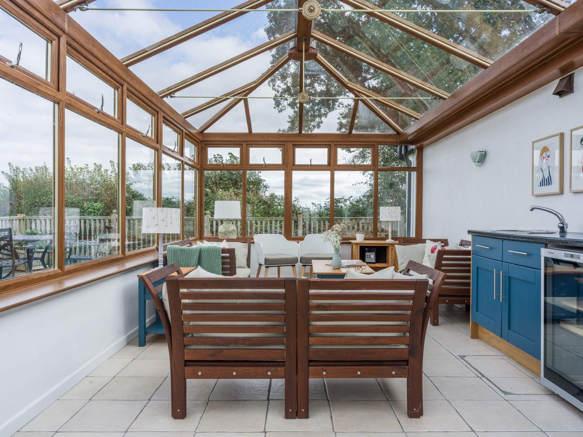 The shared conservatory is a lovely place to sit and relax on a cooler evening.