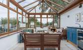 The shared conservatory is a lovely place to sit and relax on a cooler evening. - Thumbnail Image
