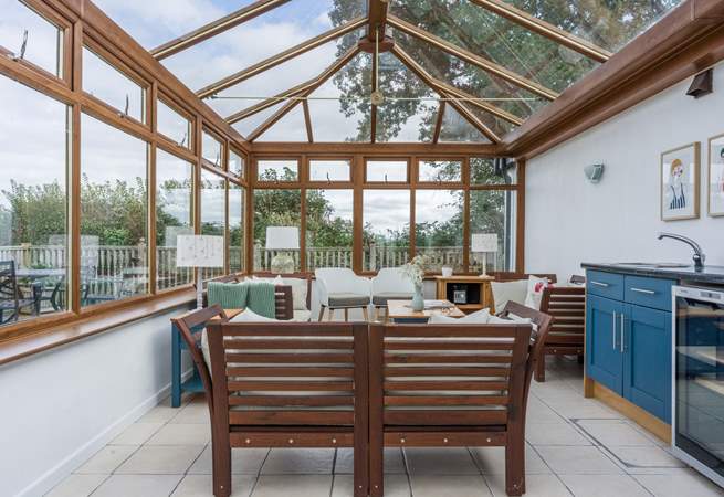 The shared conservatory is a lovely place to sit and relax on a cooler evening.