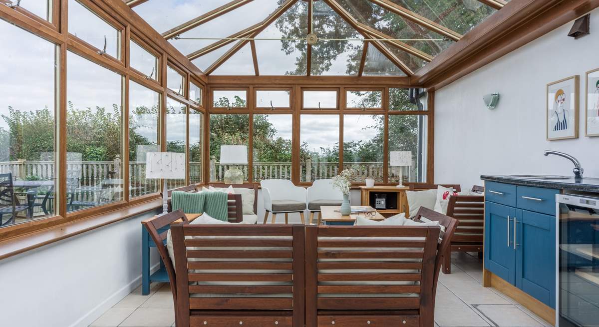 The shared conservatory is a lovely place to sit and relax on a cooler evening.