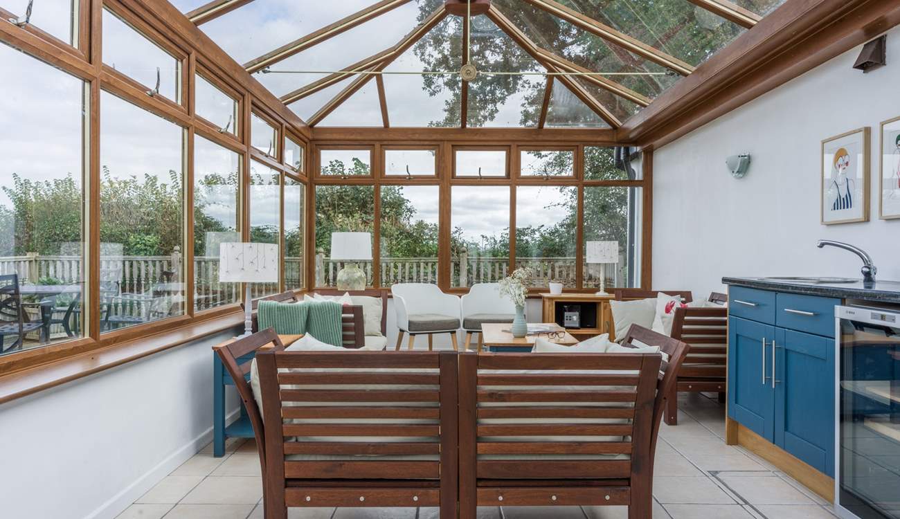 The shared conservatory is a lovely place to sit and relax on a cooler evening.
