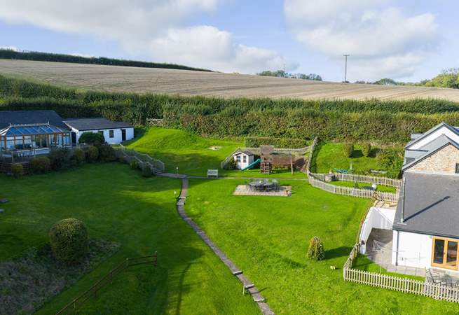 Head out of the gate and follow the path to the swimming pool and games-room.