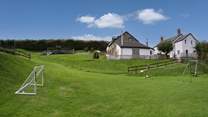 Looking up to Wren Cottage from the children's play area.